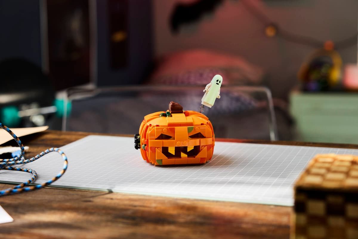 A toy pumpkin on a paper