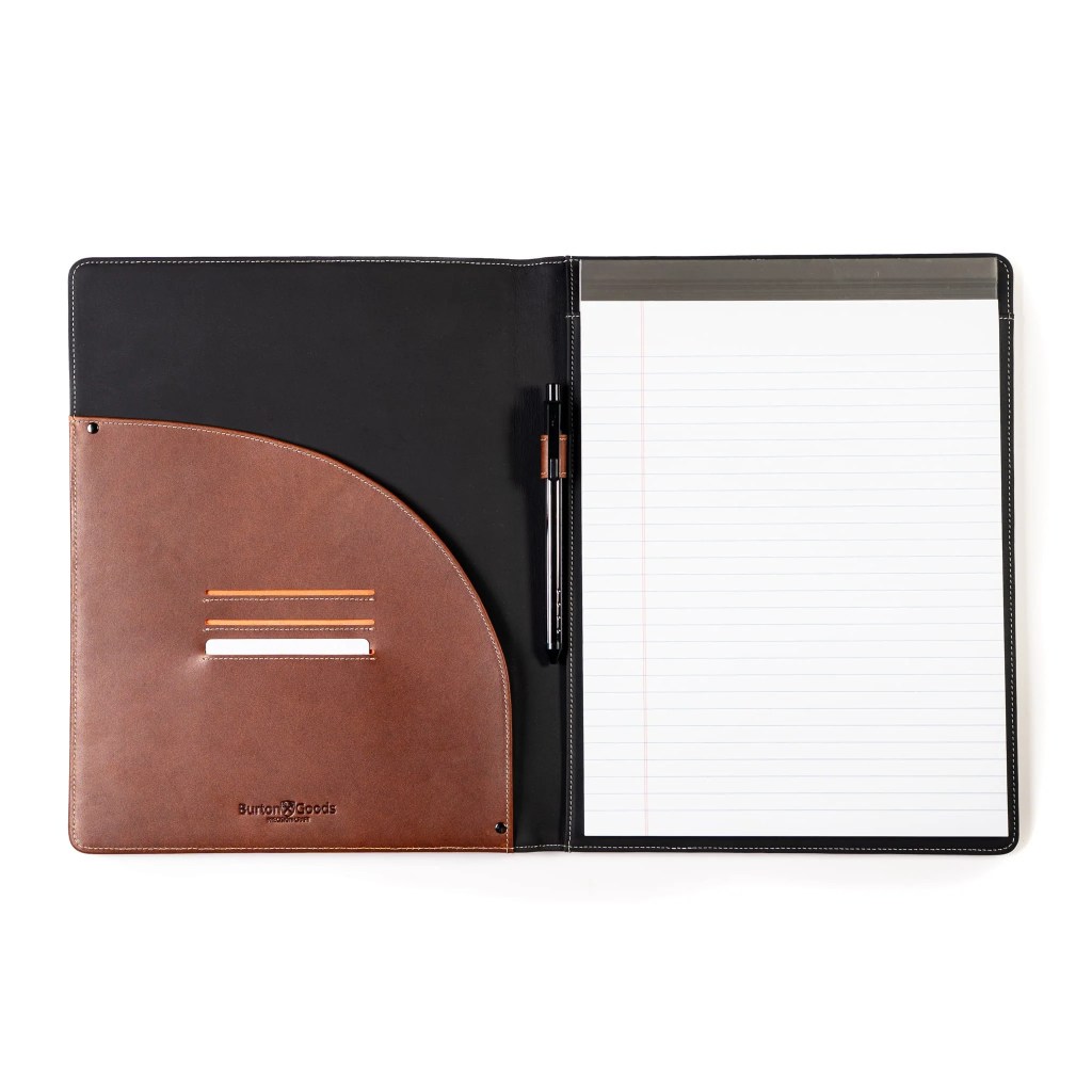 A notebook and pen in a leather case