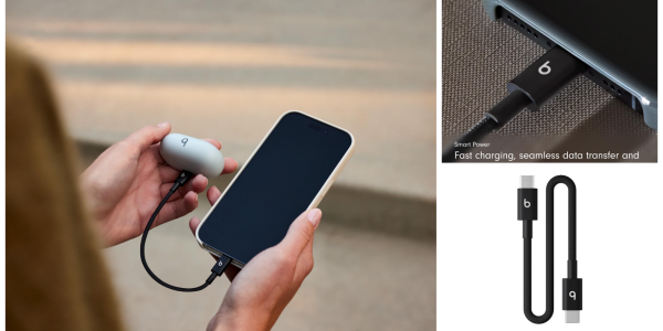 A person holding a phone and a charger