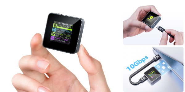 A hand holding a small square device