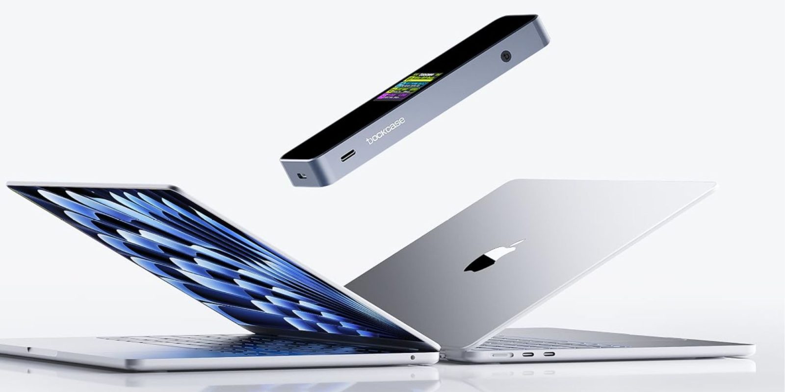 A group of laptops with a device in the air