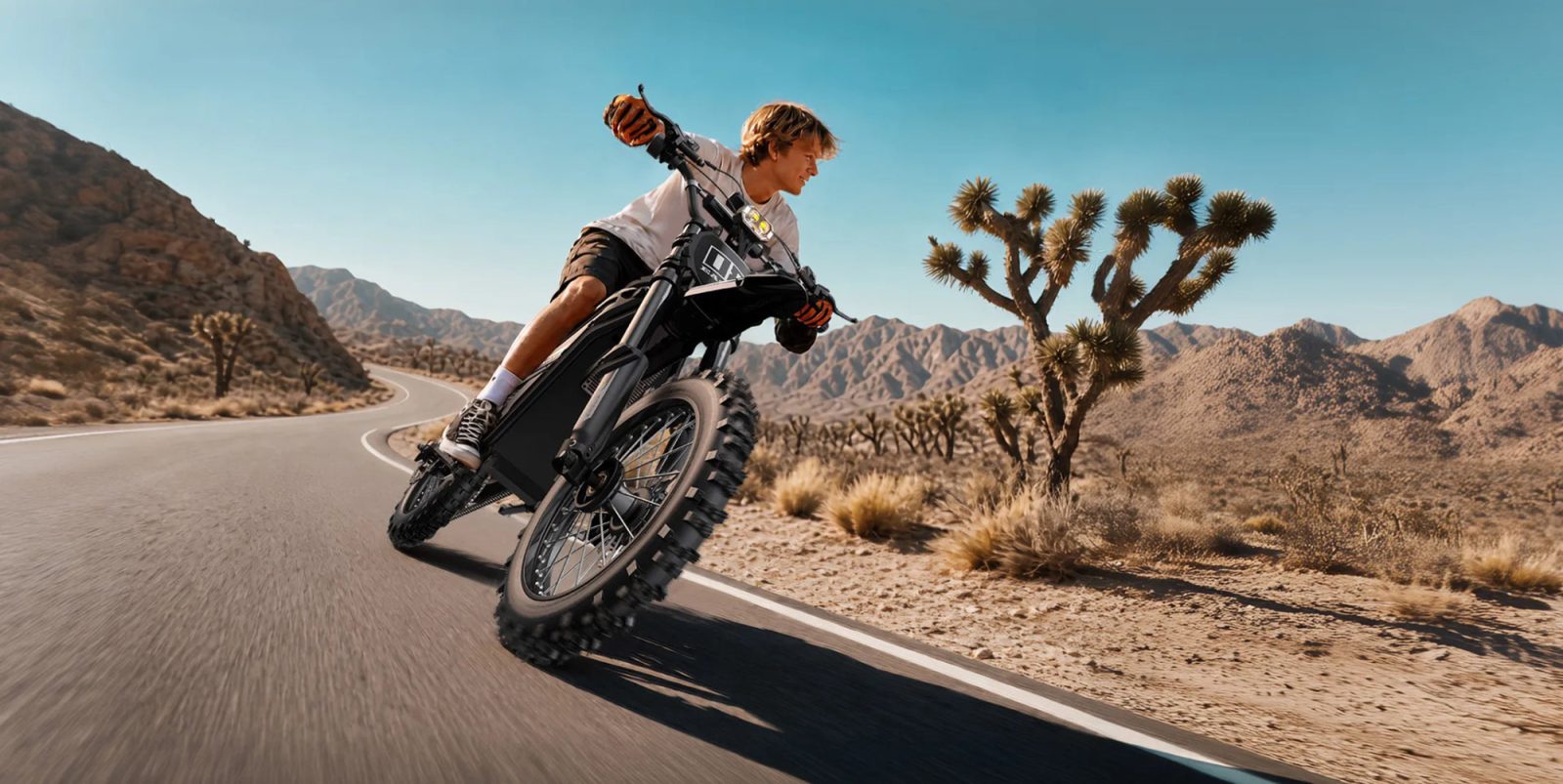 A man riding a motorcycle on a road