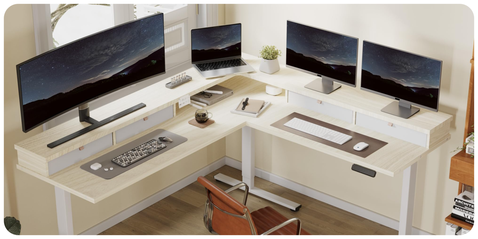 A desk with computers and a laptop