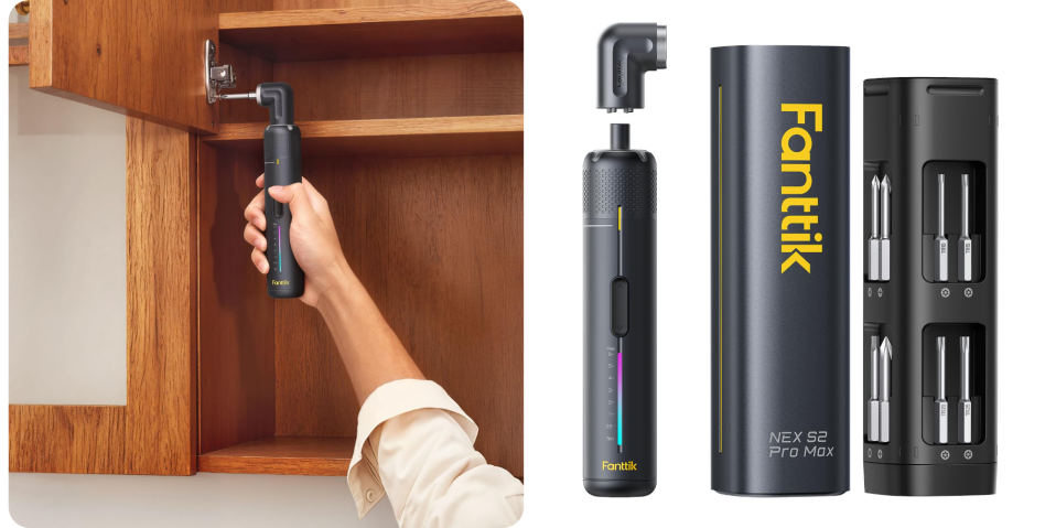 A hand holding a black cylinder