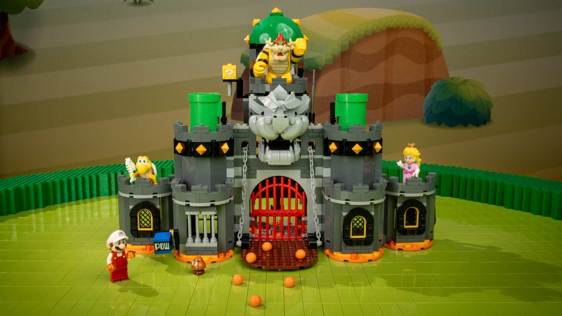 A toy castle with a group of people and a building