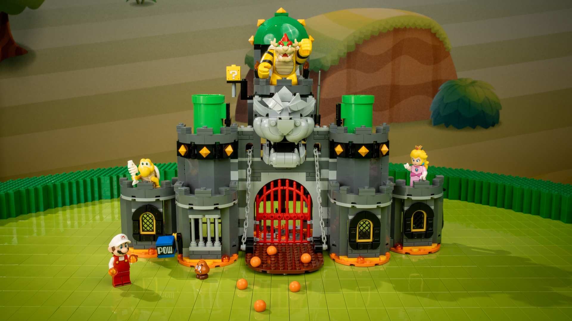 A toy castle with a group of people and a building