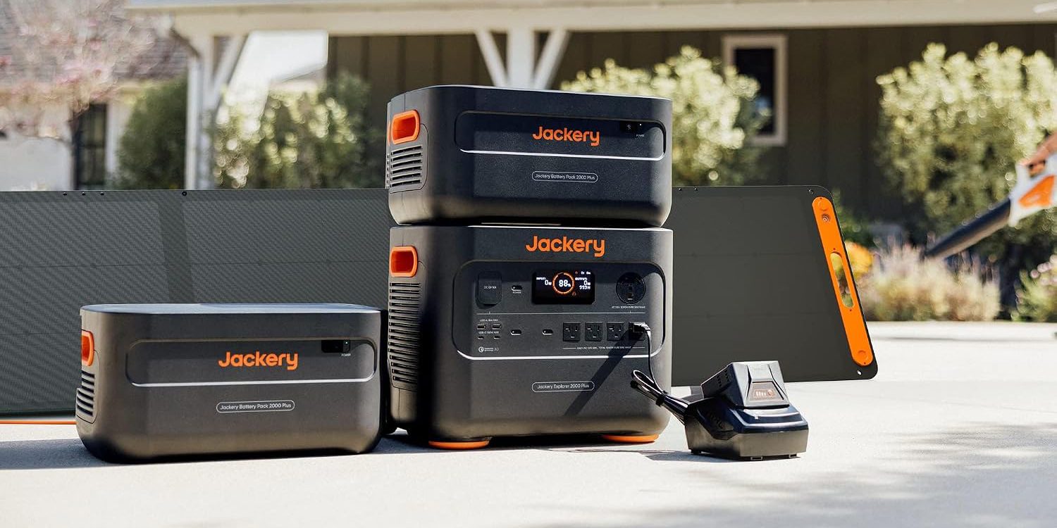 A stack of black and orange electronic devices