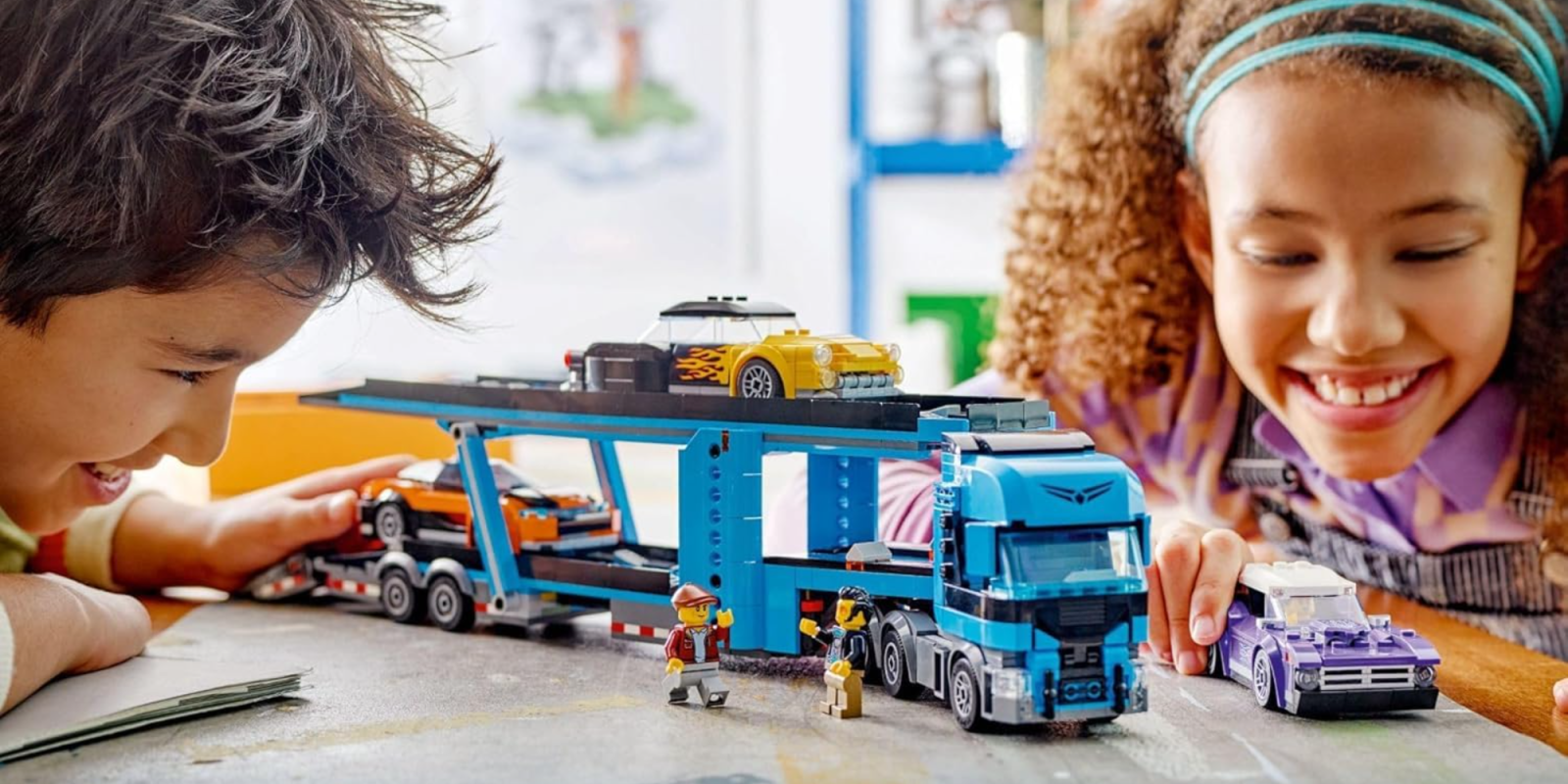 A toy truck with cars on it