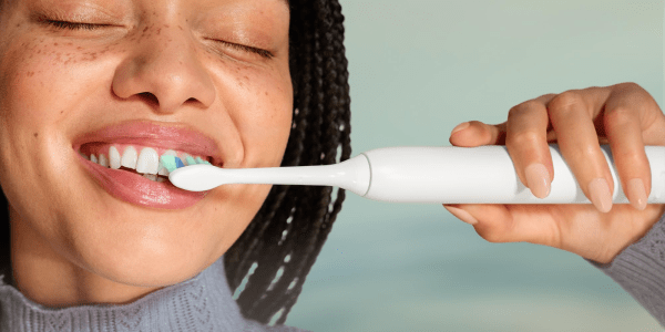 A person brushing their teeth