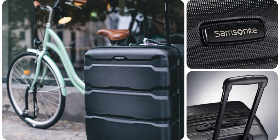 A black suitcase with handle and handlebars