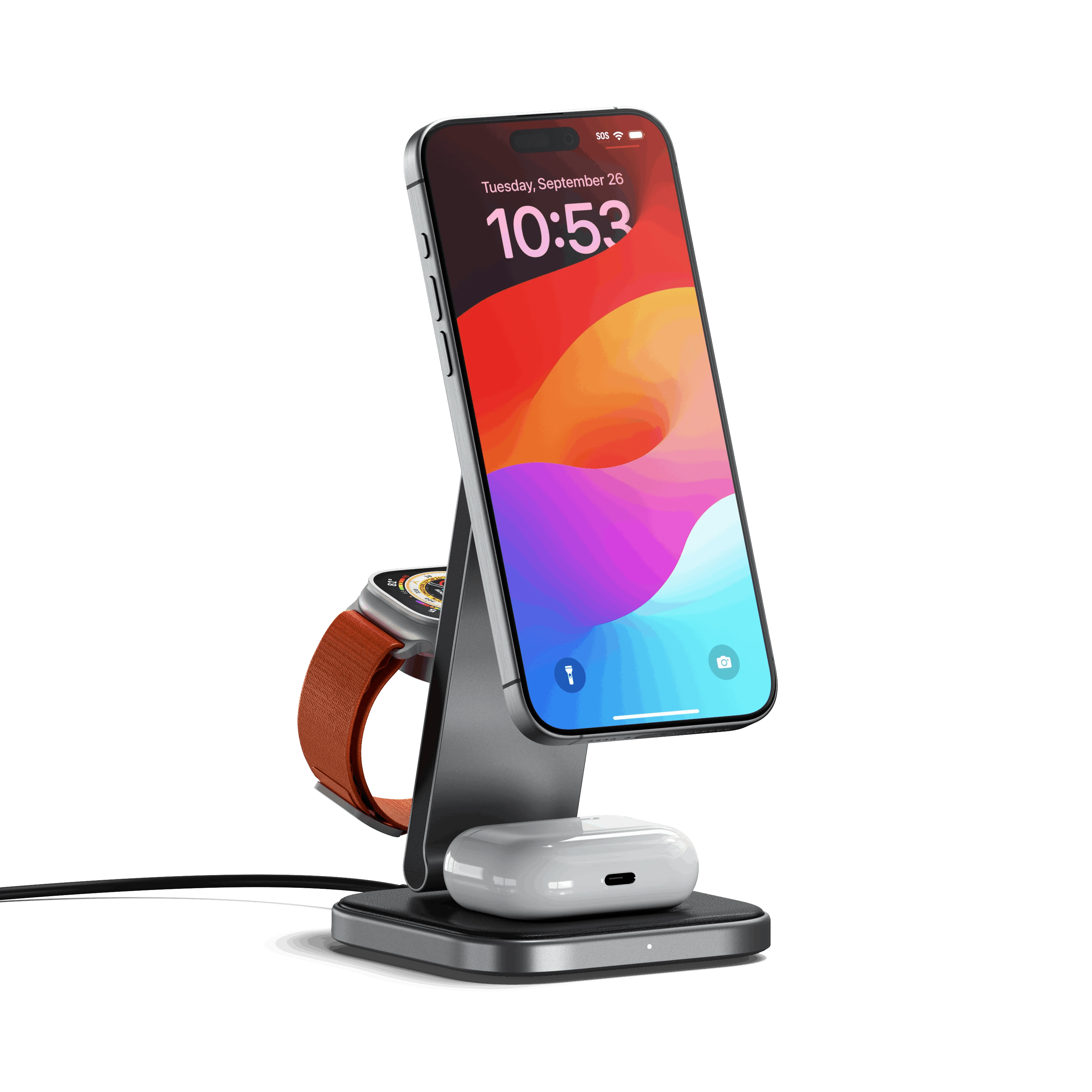A cell phone and watch on a charging stand