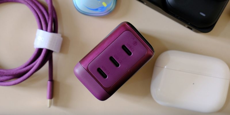 A purple usb charger on a table