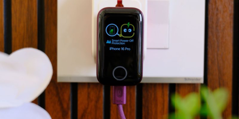 A smart watch charging on a wall