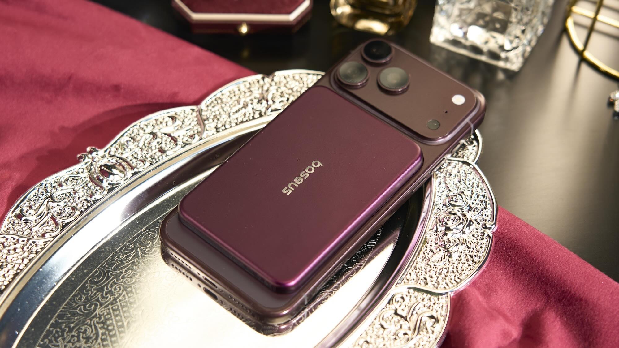A cell phone on a silver tray