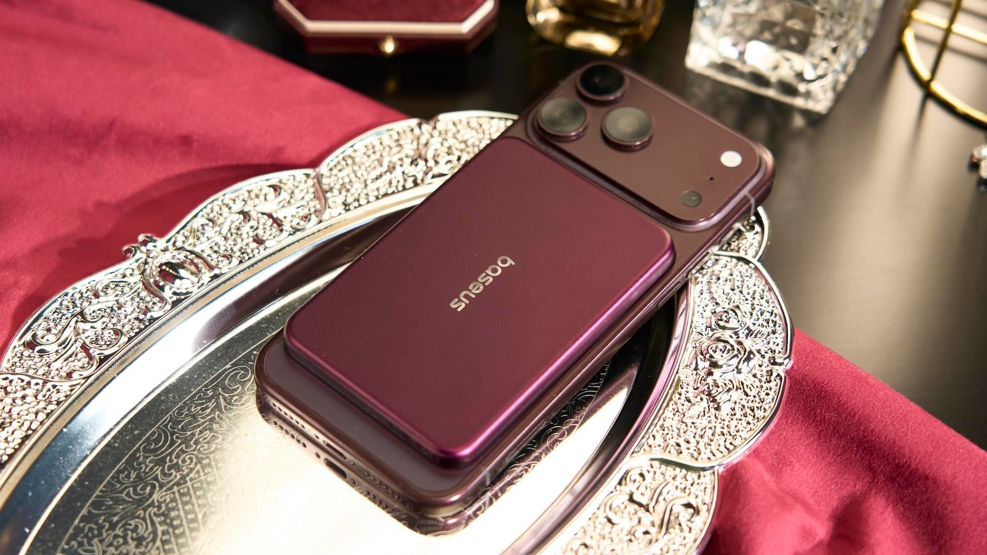 A cell phone on a silver tray
