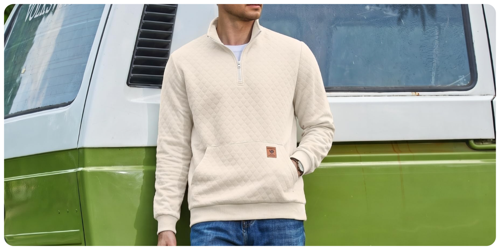 A man wearing a white sweater