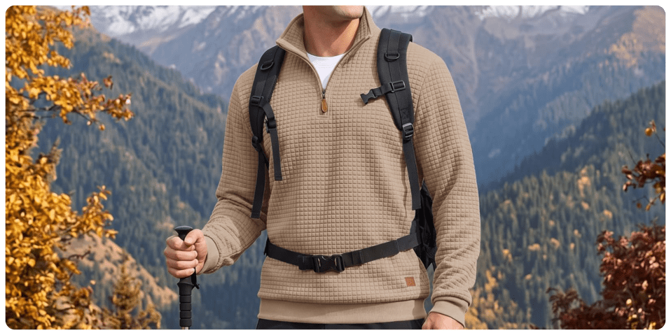 A man wearing a backpack and holding a walking stick