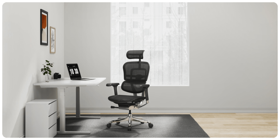 A chair and a laptop on a table