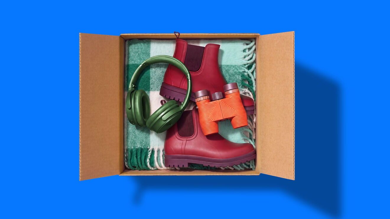 A box with boots headphones and binoculars