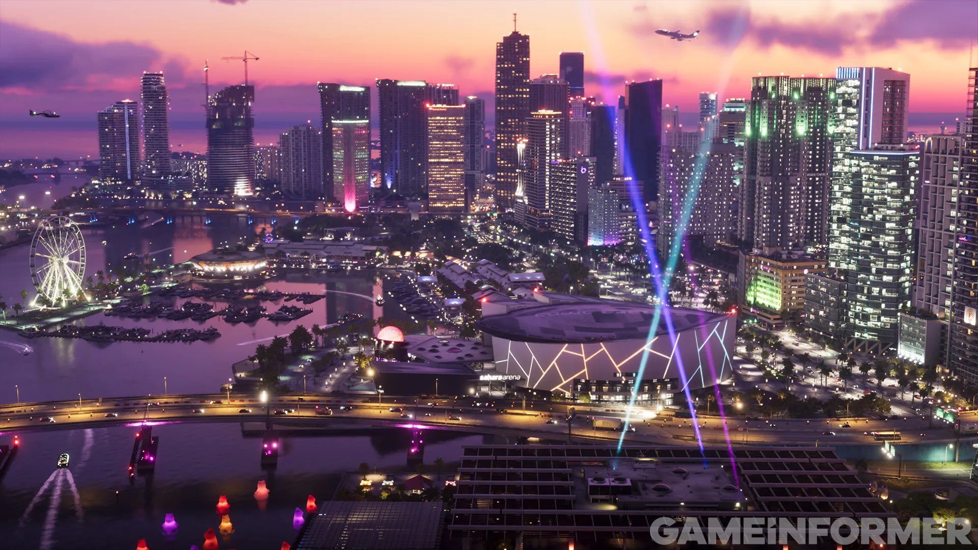 A city with lights and a body of water