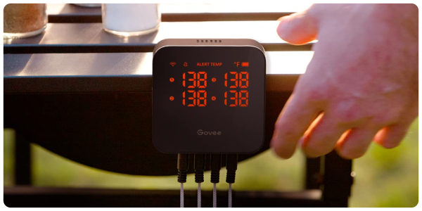 A digital clock with orange numbers