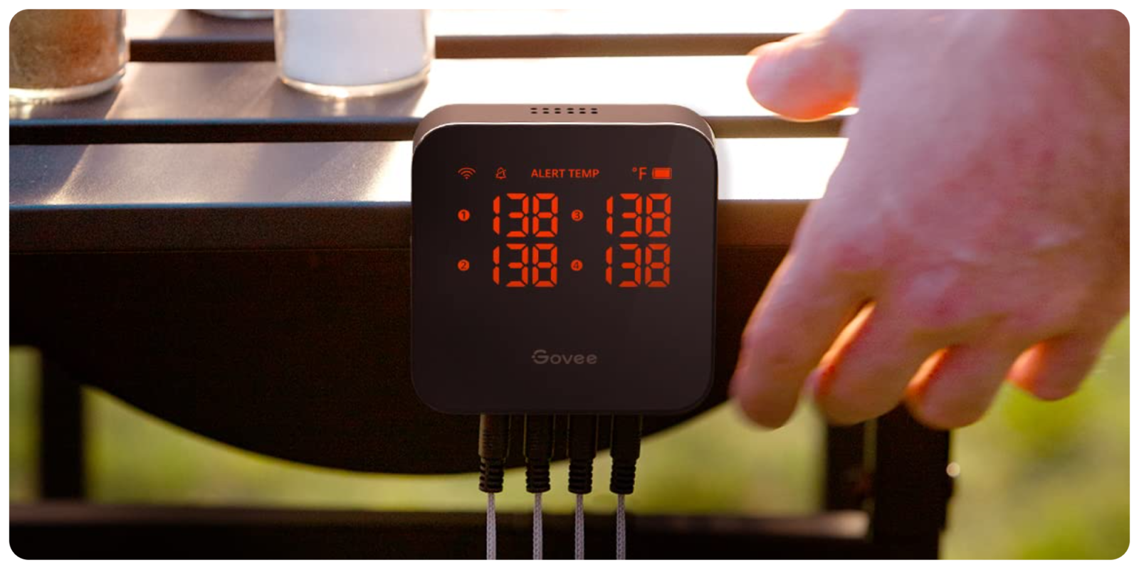 A digital clock with orange numbers