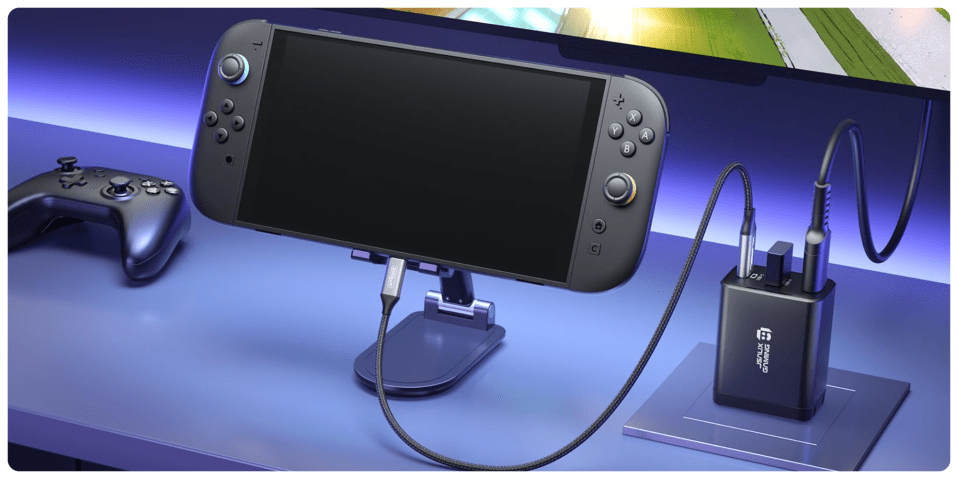 A video game console with a cord attached to a stand