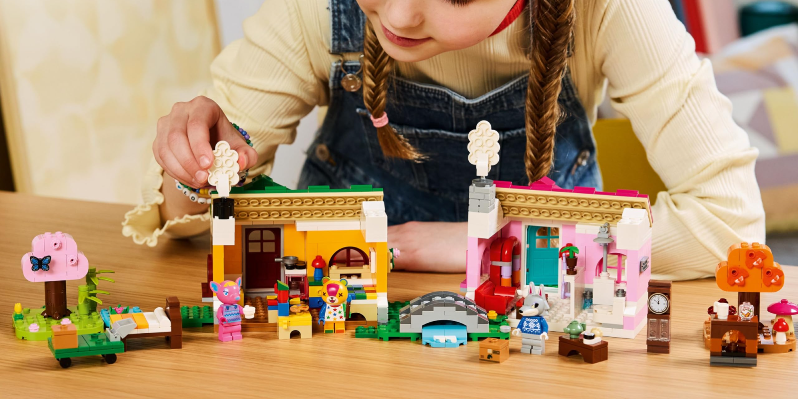 A girl playing with lego blocks