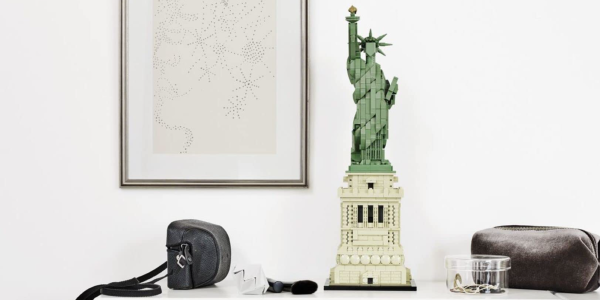 A statue of liberty and a bag on a shelf