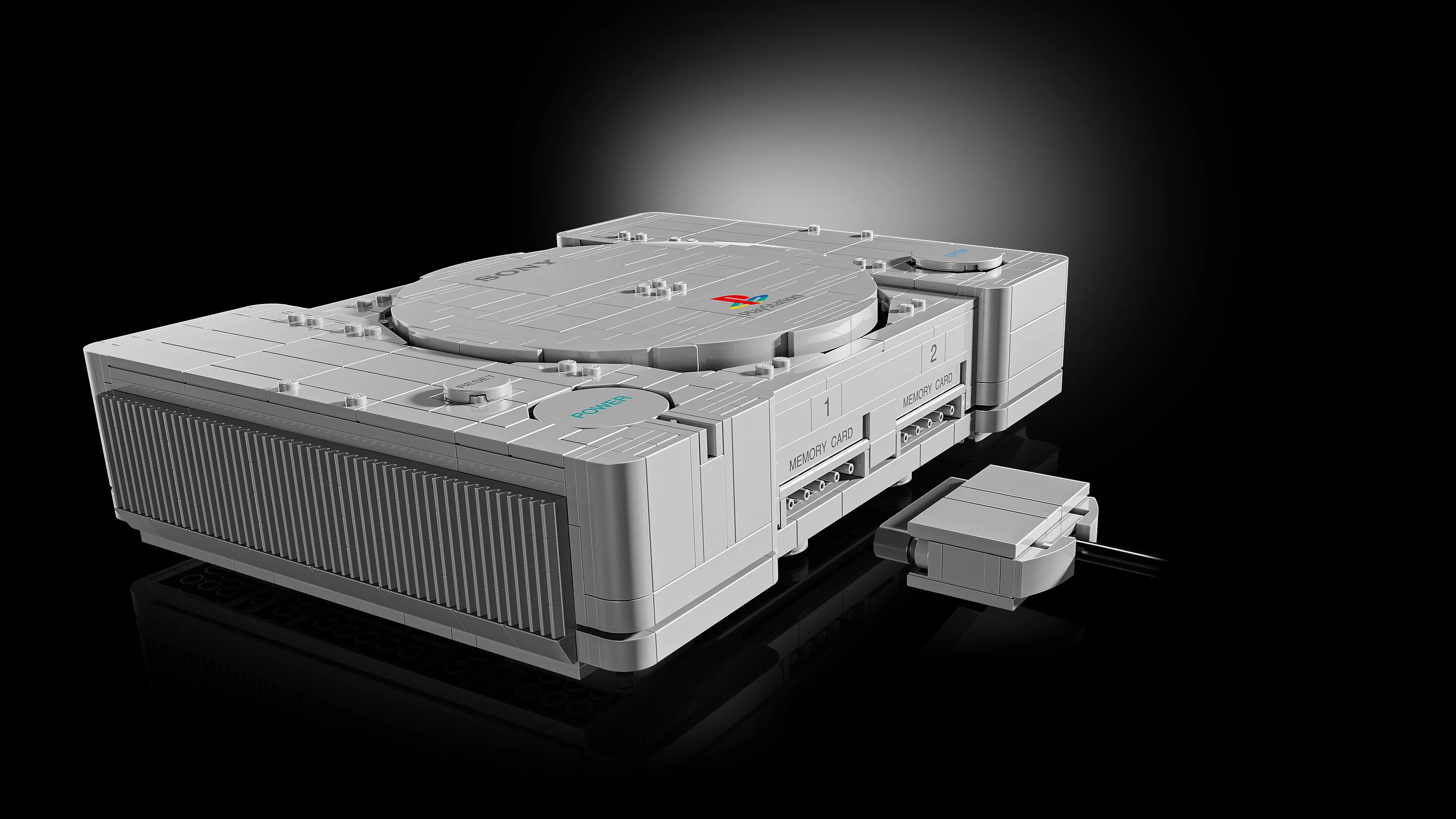 A white gaming console with a cable