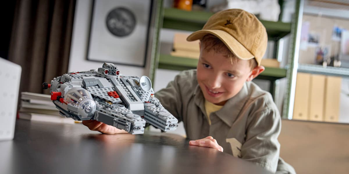 A boy holding a toy