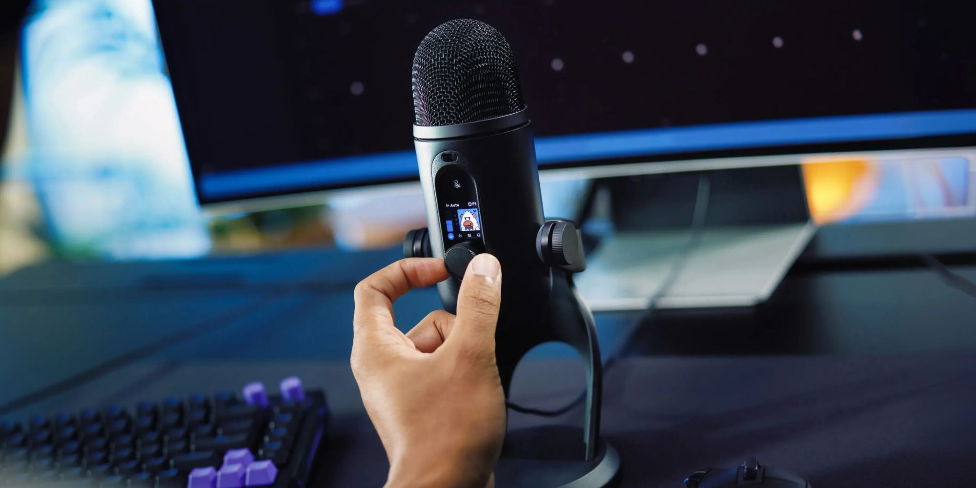 A hand holding a microphone