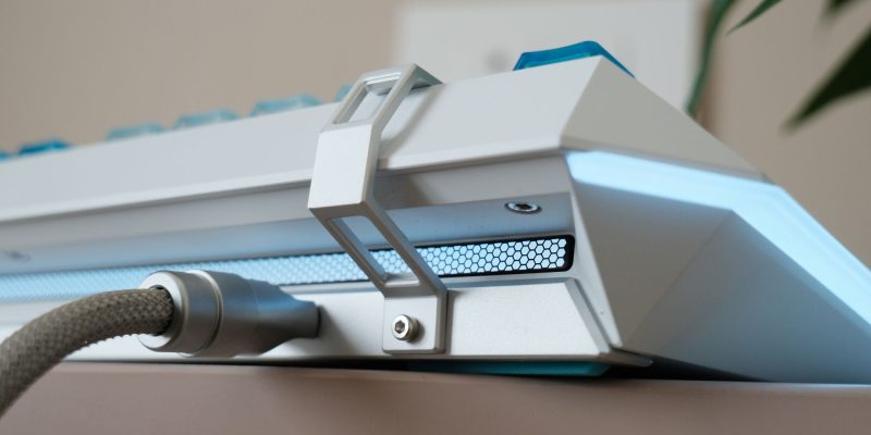 A white device with a blue light