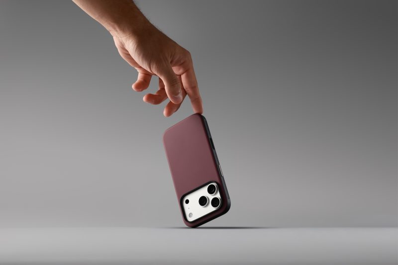 A hand holding a cell phone