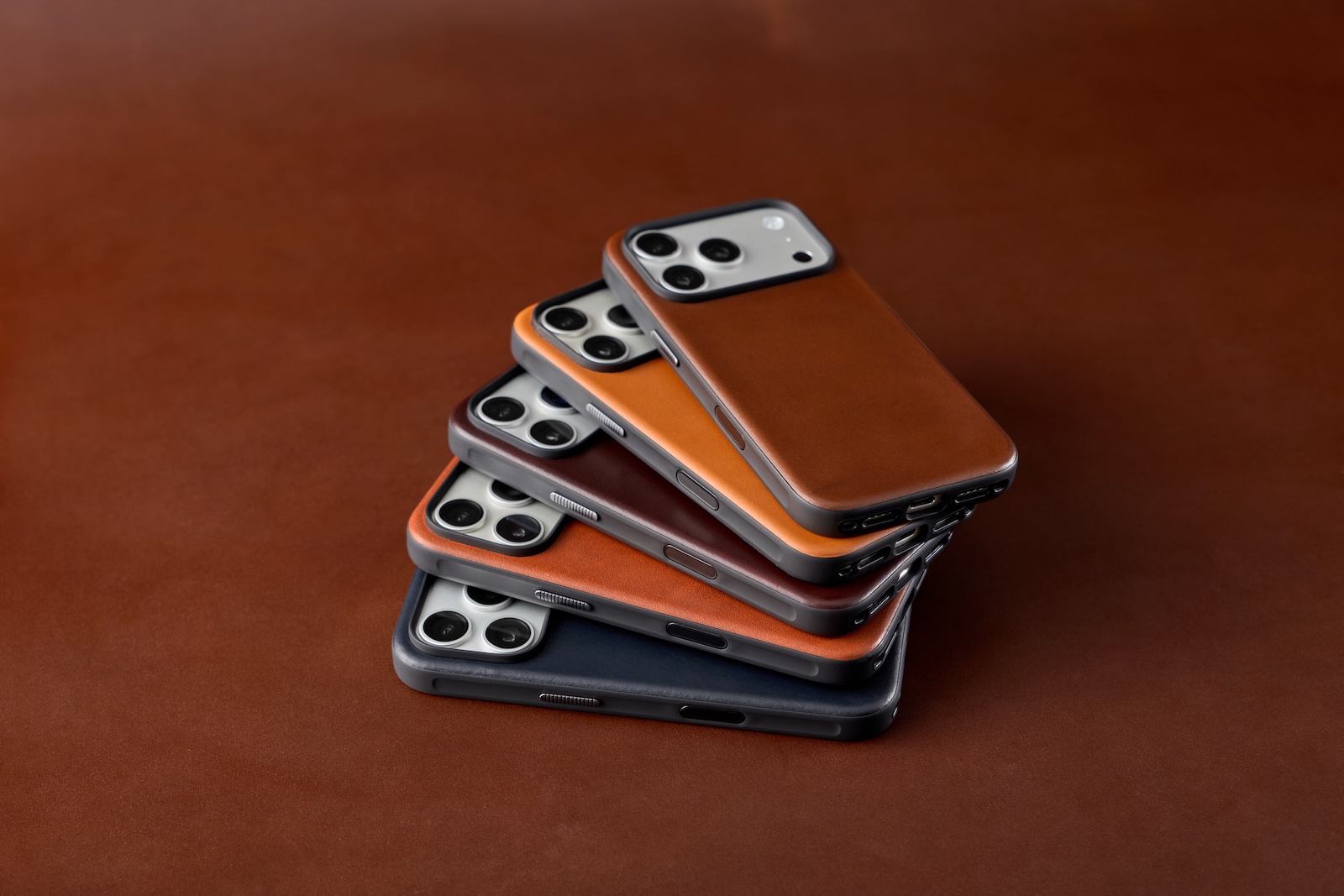 A group of cell phones stacked on top of each other