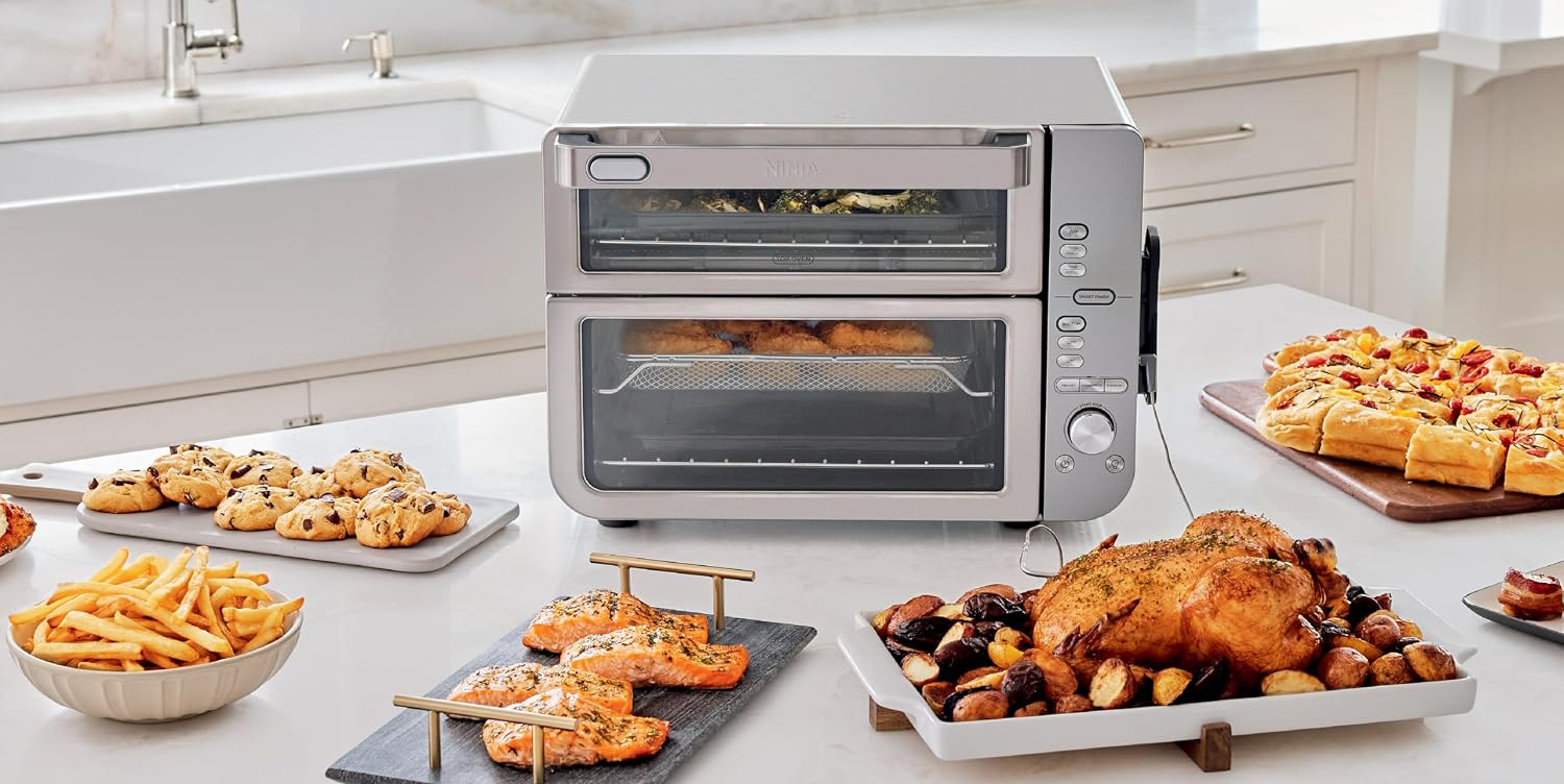 A toaster oven with food on a table