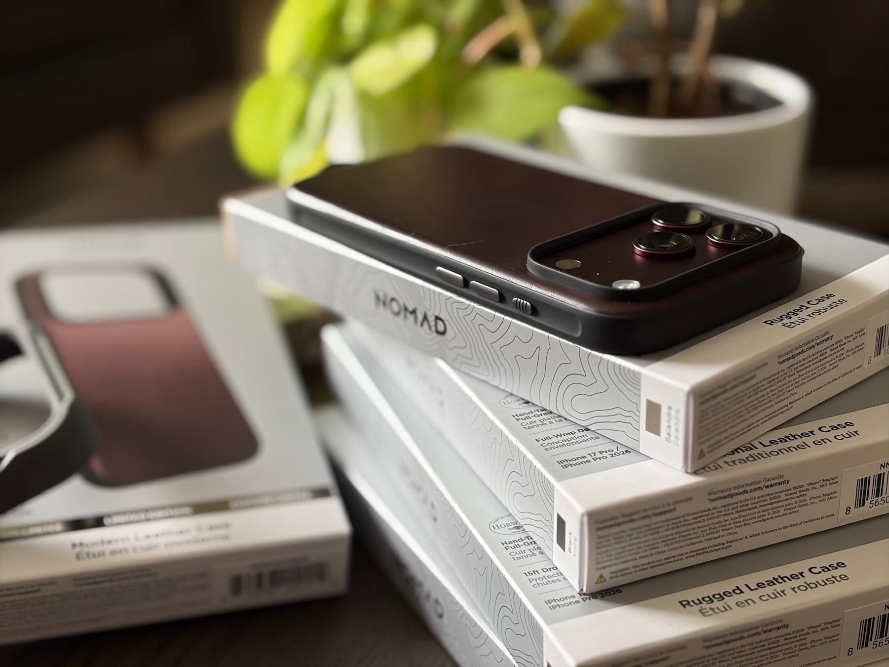 A cell phone on top of boxes