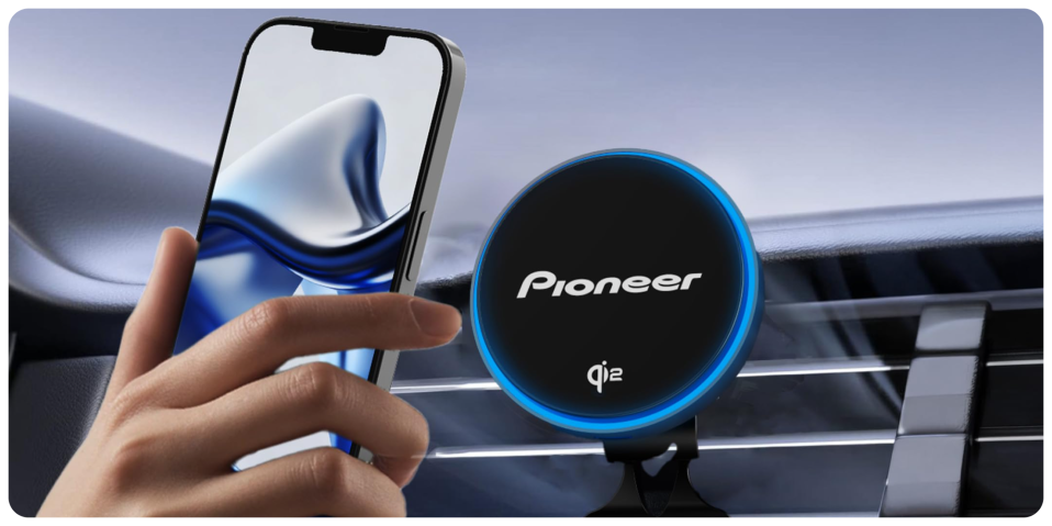 A hand holding a phone and a circular device