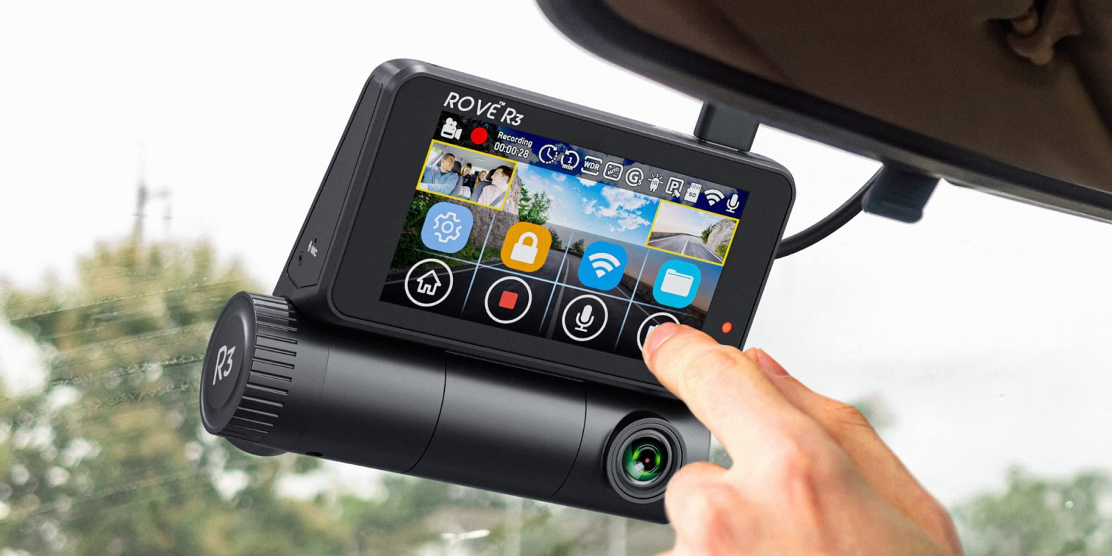 A hand touching a car camera