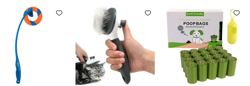 A hand holding a brush with a cat
