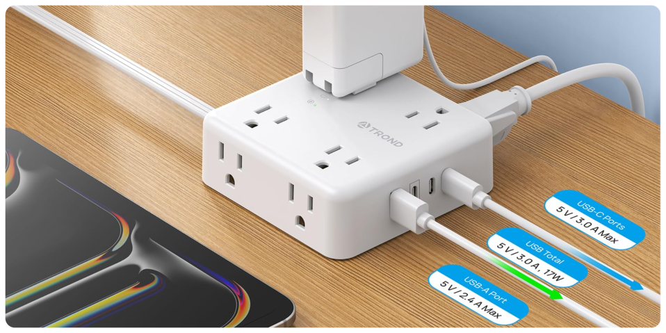 A white power strip with plugs