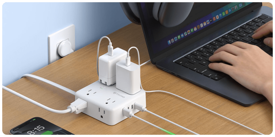 A white power strip with multiple plugs