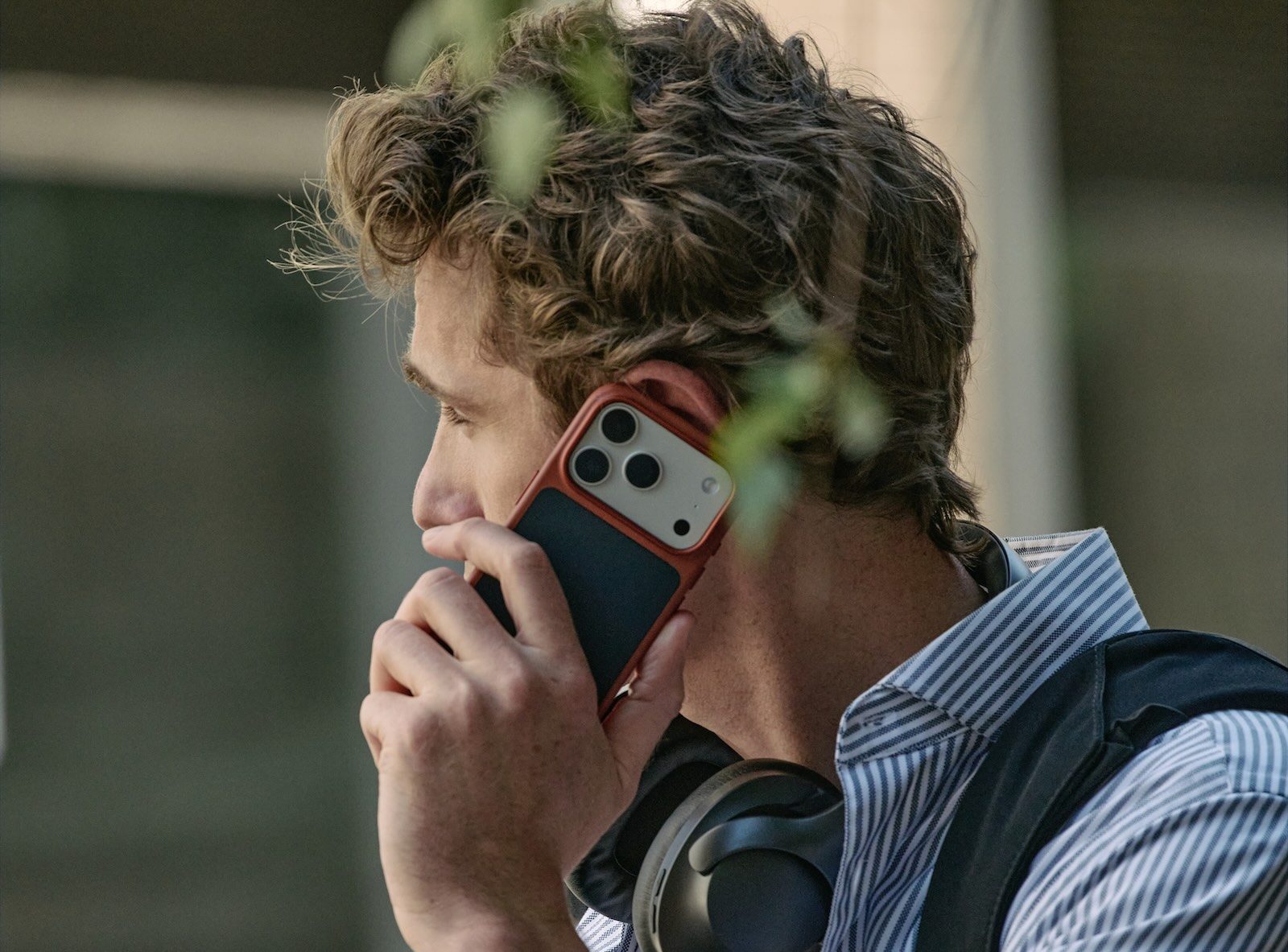 A man holding a cell phone to his ear