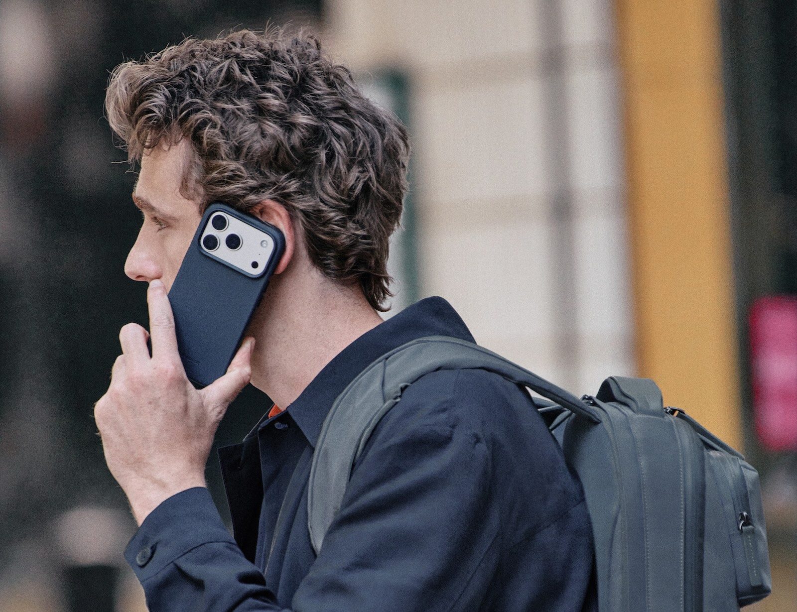 A man holding a cell phone to his ear