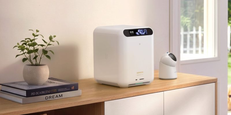 A white square device on a table