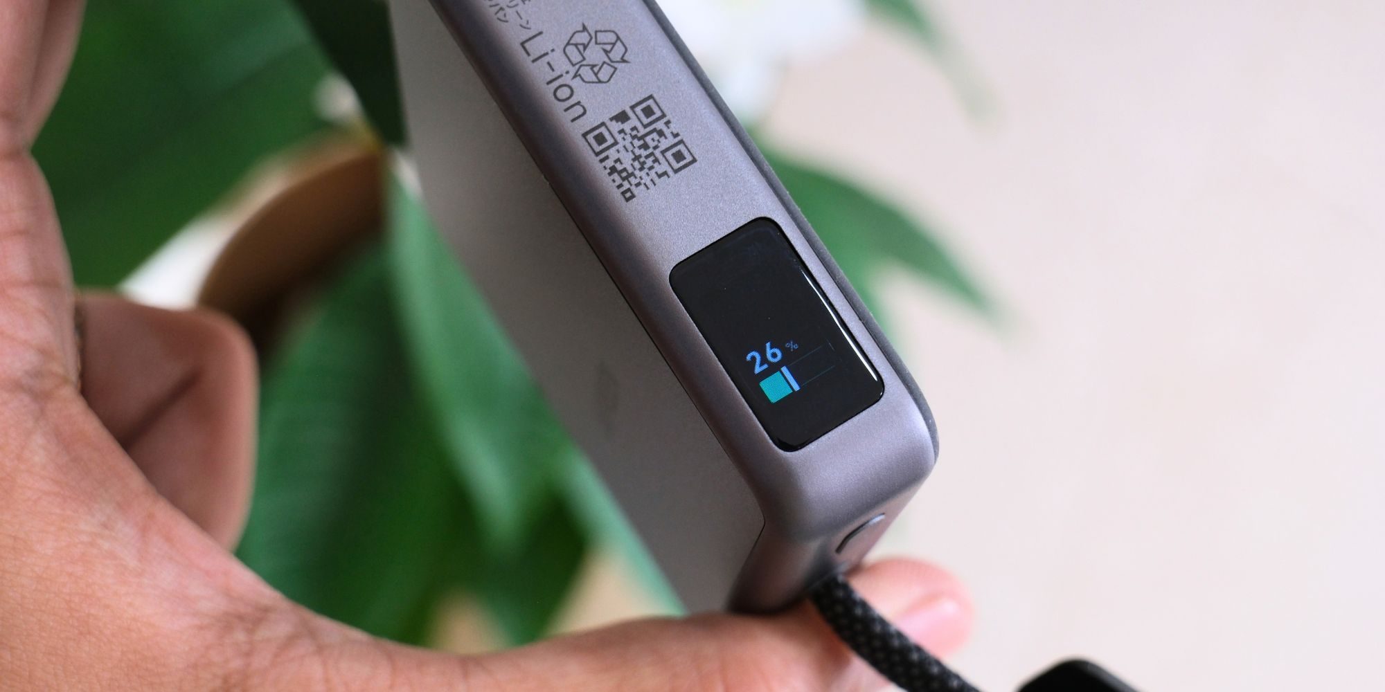 A hand holding a device