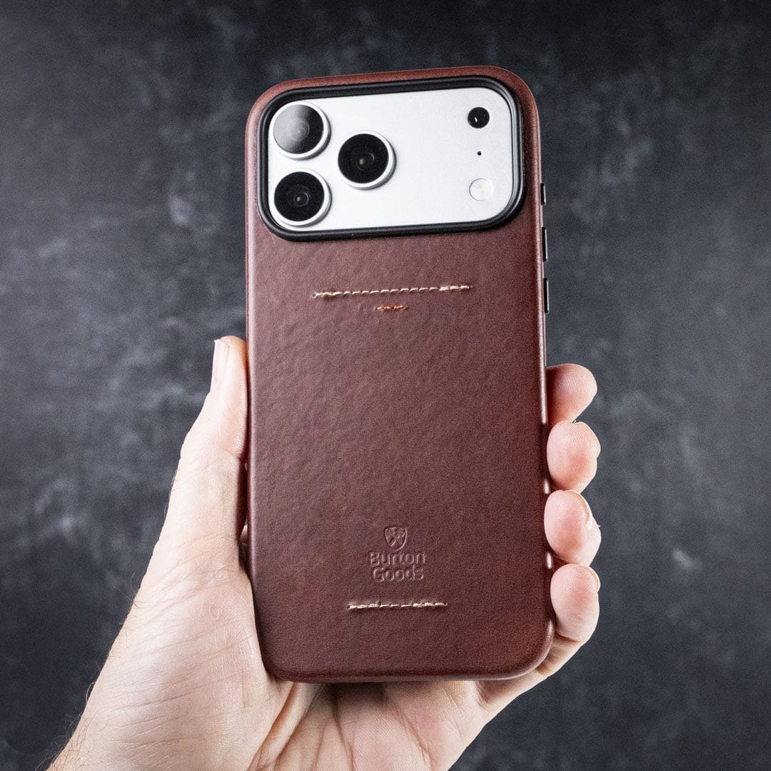 A hand holding a phone case