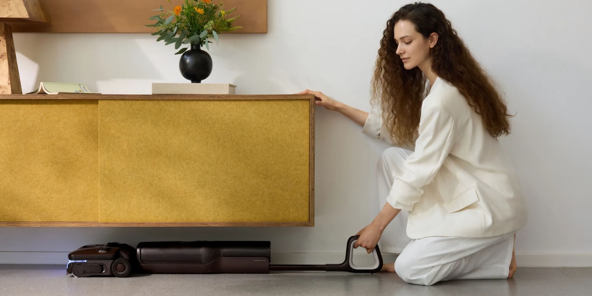 A woman cleaning a picture