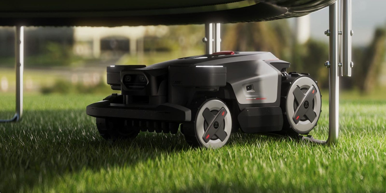 A black robot on grass