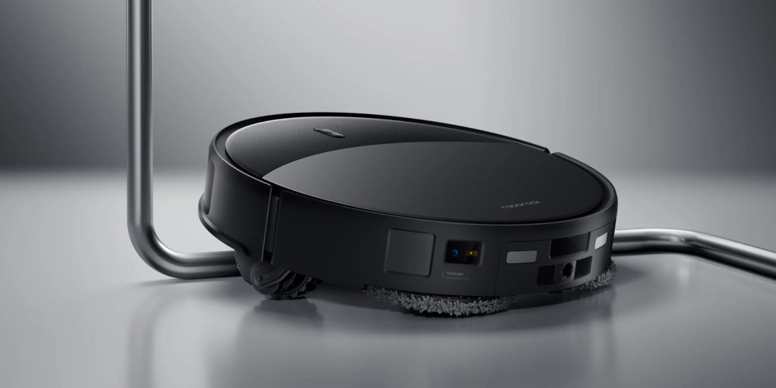 A black robot vacuum cleaner